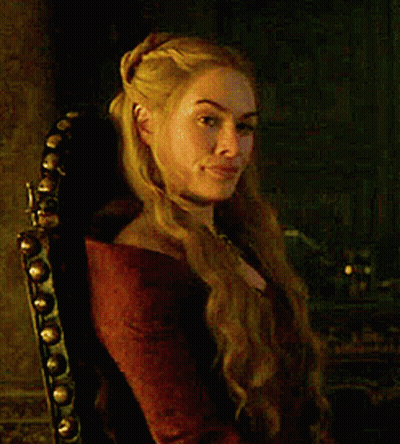 A Woman With Blonde Hair Is Sitting In A Chair GIF