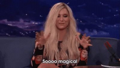 A Woman With Blonde Hair Is Sitting On A Couch With Her Arms Outstretched And Says `` Soooo Magical '' . GIF