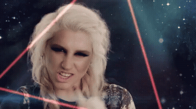 A Woman With Blonde Hair Is Surrounded By Red Lights GIF