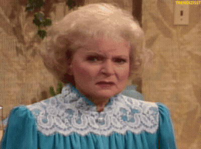 A Woman With Blonde Hair Is Wearing A Blue Dress With White Lace . GIF