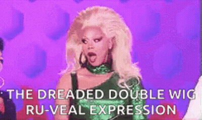 A Woman With Blonde Hair Is Wearing A Green Dress And A Green Wig . GIF