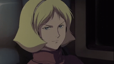 A Woman With Blonde Hair Is Wearing Headphones And Smiling GIF