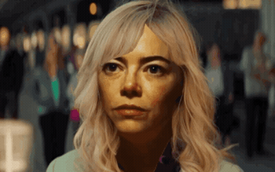 A Woman With Blonde Hair Looks At The Camera GIF