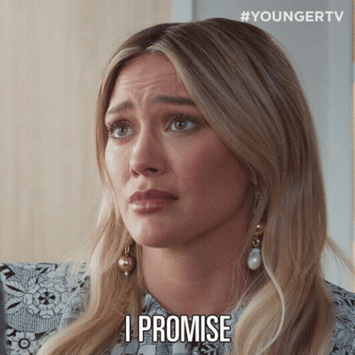 A Woman With Blonde Hair Says I Promise On Her Face GIF