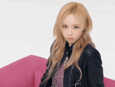 A Woman With Blonde Hair Wearing A Black Leather Jacket GIF