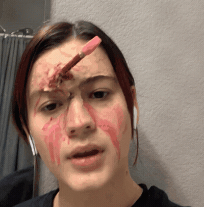 A Woman With Blood On Her Face Has A Pencil In Her Eye GIF