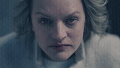 A Woman With Blue Eyes Is Looking At The Camera GIF