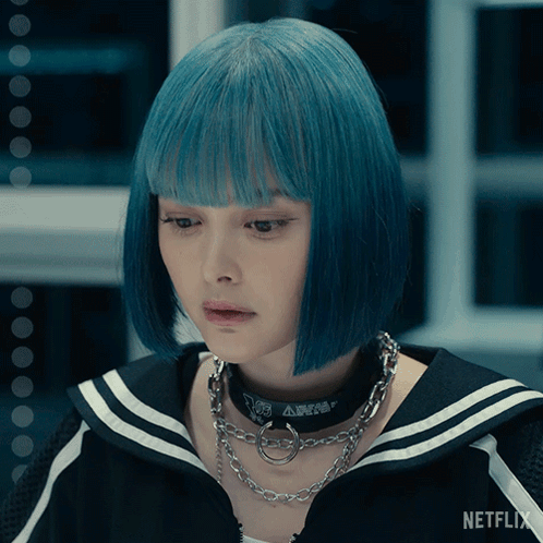 A Woman With Blue Hair And A Netflix Logo On The Bottom Right GIF