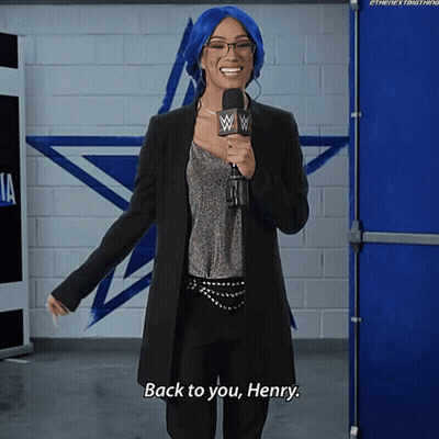 A Woman With Blue Hair And Glasses Is Holding A Microphone And Says Back To You Henry GIF