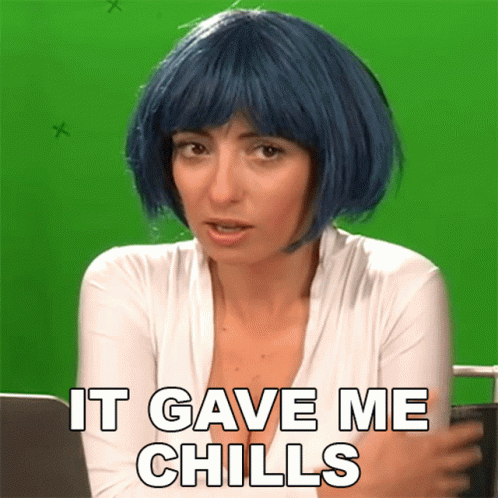 A Woman With Blue Hair Has The Words It Gave Me Chills Above Her GIF