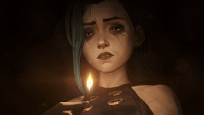 A Woman With Blue Hair Is Holding A Lit Candle In Her Hand GIF