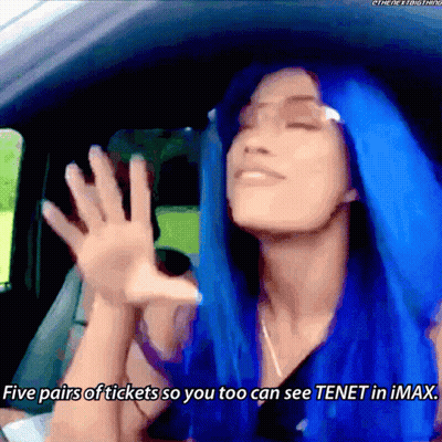 A Woman With Blue Hair Is In A Car And Says Five Pairs Of Tickets So You Too Can See Tenet In Imax GIF
