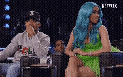 A Woman With Blue Hair Is Sitting Next To A Man Wearing A Number 3 Hat GIF