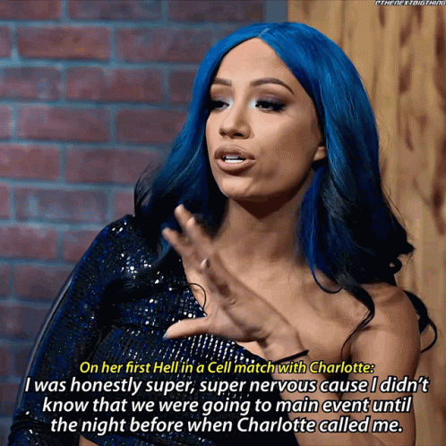 A Woman With Blue Hair Is Talking About A Cell Match With Charlotte GIF