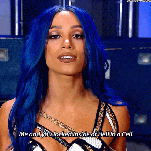 A Woman With Blue Hair Is Talking About Being Locked Inside Of Hell In A Cell GIF