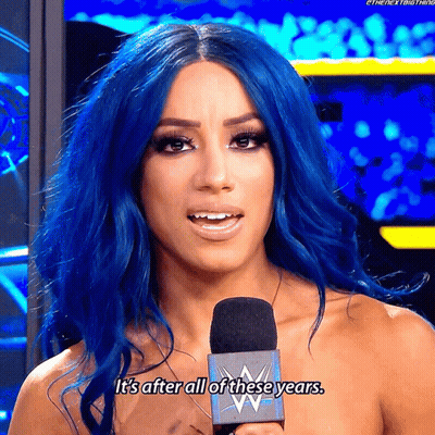 A Woman With Blue Hair Is Talking Into A Microphone And Says It 'S After All Of These Years . GIF