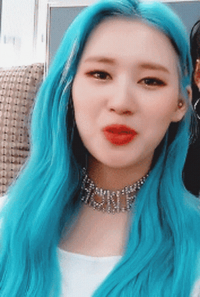 A Woman With Blue Hair Is Wearing A Choker That Says ' Shine ' On It GIF