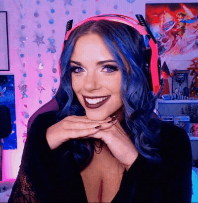 A Woman With Blue Hair Is Wearing A Headset GIF