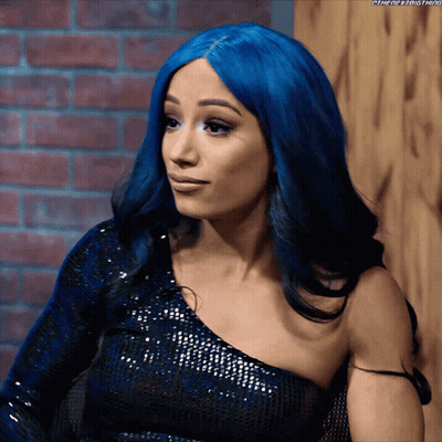 A Woman With Blue Hair Is Wearing A One Shoulder Dress GIF