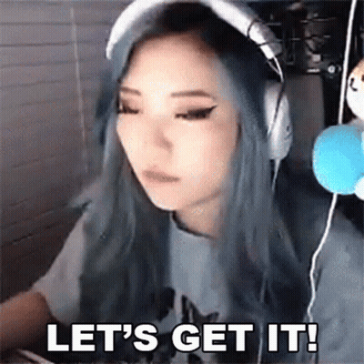 A Woman With Blue Hair Is Wearing Headphones And Says Let 'S Get It ! GIF