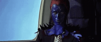 A Woman With Blue Paint On Her Face Is Sitting In A Car . GIF
