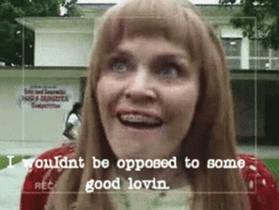 A Woman With Braces On Her Teeth Is Smiling With The Words " Wouldnt Be Opposed To Some Good Lovin " On The Bottom GIF