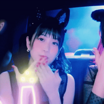 A Woman With Bunny Ears On Her Head Is Making A Funny Face GIF