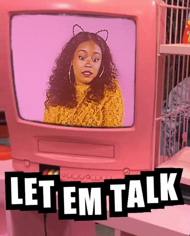 A Woman With Cat Ears Is On A Pink Tv Screen With The Words Let Em Talk GIF