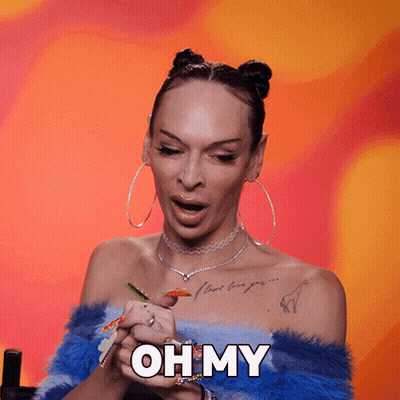 A Woman With Colorful Nails Is Holding Her Hands Together And Says Oh My GIF