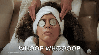 A Woman With Cucumber Slices On Her Eyes Is Laying On A Couch With The Caption Whoop Whooop GIF