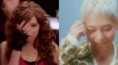 A Woman With Curly Hair And A Man With White Hair Are Standing Next To Each Other And Looking At Each Other . GIF