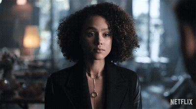 A Woman With Curly Hair And A Netflix Logo On The Bottom GIF