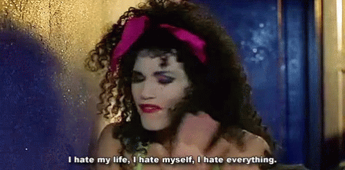 A Woman With Curly Hair And A Pink Headband Is Saying I Hate My Life I Hate Myself , I Hate Everything . GIF