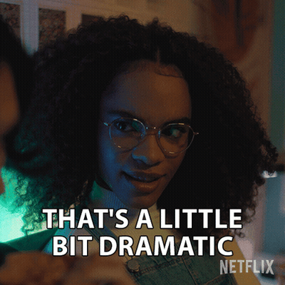 A Woman With Curly Hair And Glasses Says " That 'S A Little Bit Dramatic " GIF