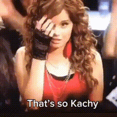 A Woman With Curly Hair Covering Her Face With Her Hand And The Words That 'S So Kachy Below Her GIF