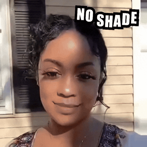 A Woman With Curly Hair Has A No Shade Sticker On Her Head GIF