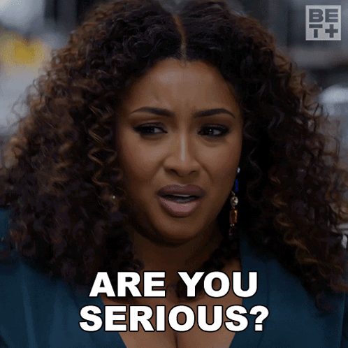 A Woman With Curly Hair Is Asking If She Is Serious GIF