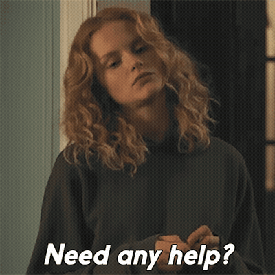 A Woman With Curly Hair Is Asking If She Needs Help GIF