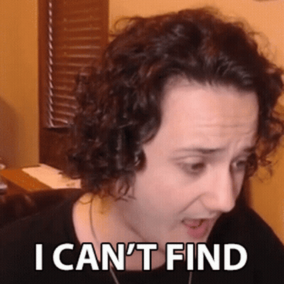 A Woman With Curly Hair Is Making A Funny Face With The Words `` I Can 'T Find '' Written On Her Face . GIF