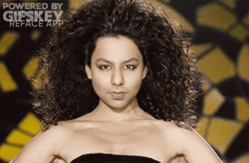 A Woman With Curly Hair Is Powered By Gifkey GIF