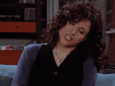 A Woman With Curly Hair Is Sitting On A Couch And Says You Know What Why Don T You Just Shut The Hell Up ... GIF