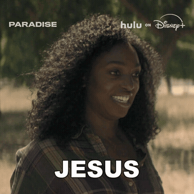 A Woman With Curly Hair Is Smiling And The Word Jesus Is On Her Face GIF