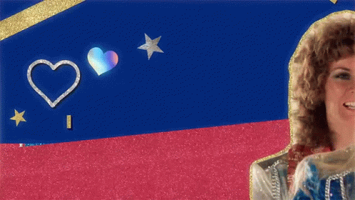 A Woman With Curly Hair Is Smiling In Front Of A Blue And Red Background GIF