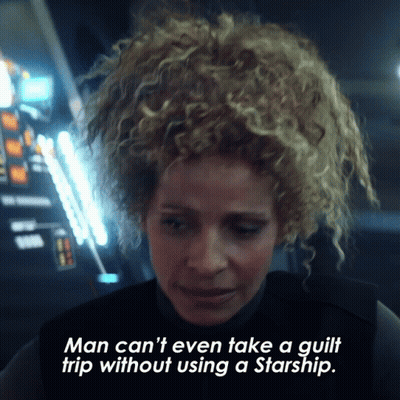 A Woman With Curly Hair Is Talking About Using A Starship GIF