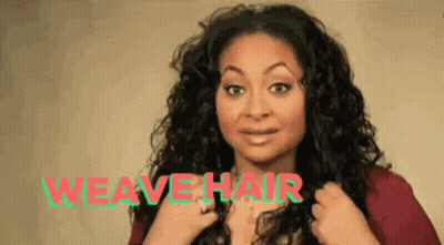 A Woman With Curly Hair Is Wearing A Red Shirt And Holding Her Hair In Front Of The Words `` Weave Hair '' . GIF