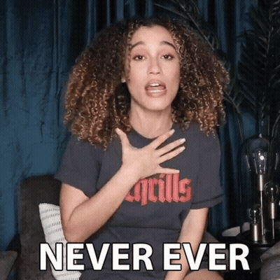A Woman With Curly Hair Is Wearing A T-Shirt That Says Never Ever GIF