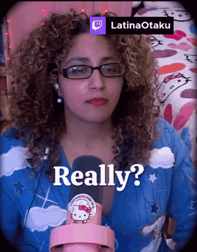 A Woman With Curly Hair Is Wearing Glasses And A Hello Kitty Shirt And Says Really GIF