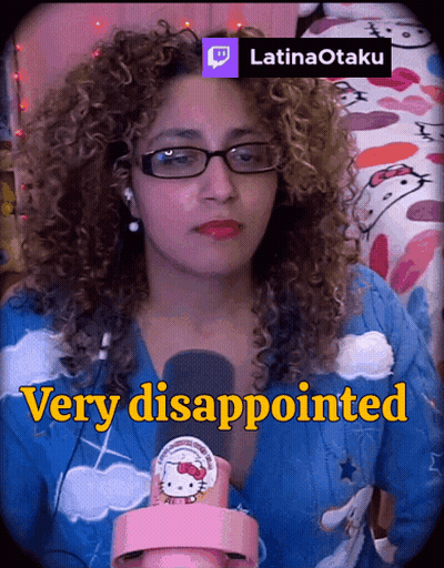 A Woman With Curly Hair Is Wearing Glasses And A Hello Kitty Sweater GIF