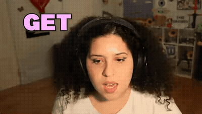 A Woman With Curly Hair Is Wearing Headphones And Says Get GIF