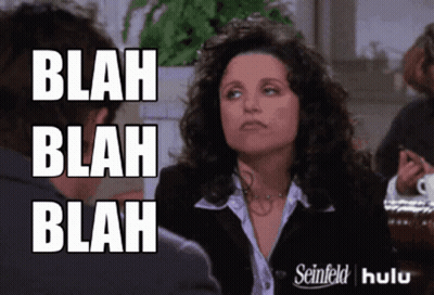 A Woman With Curly Hair Says Blah Blah Blah In Front Of A Man GIF